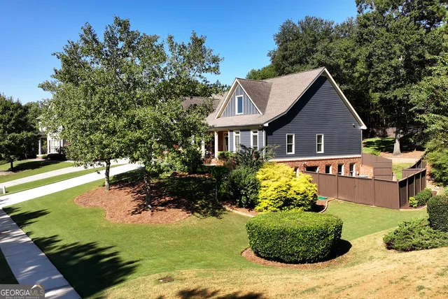 a view of a backyard with sitting area