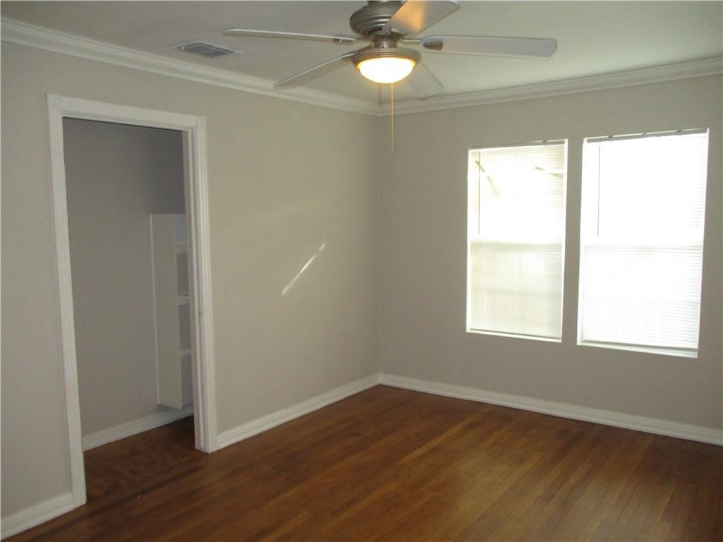 4110 Callicoatte Road Corpus Christi, TX 78410 - Photo 12 of 16 an empty room with wooden floor closet and windows