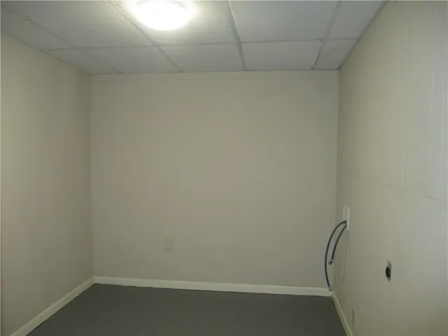 a view of a house with backyard and porch