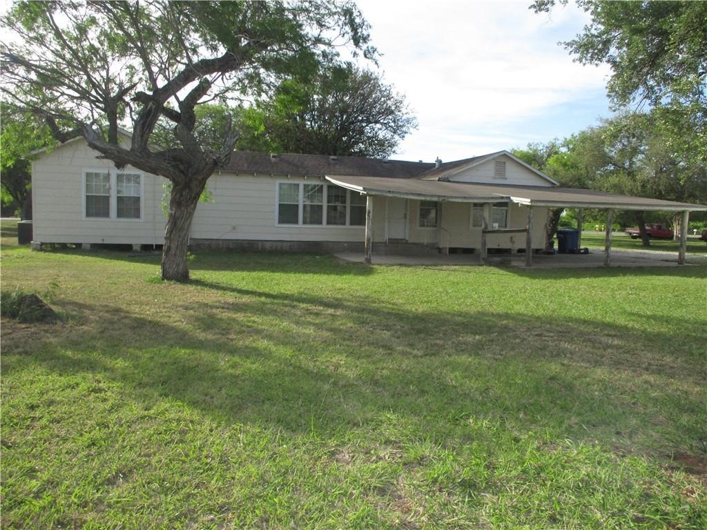 4110 Callicoatte Road Corpus Christi, TX 78410 - Photo 16 of 16 a front view of a house with a garden