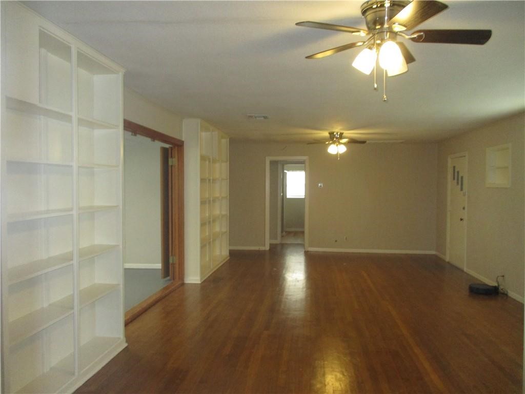 4110 Callicoatte Road Corpus Christi, TX 78410 - Photo 3 of 16 wooden floor in an empty room with a window