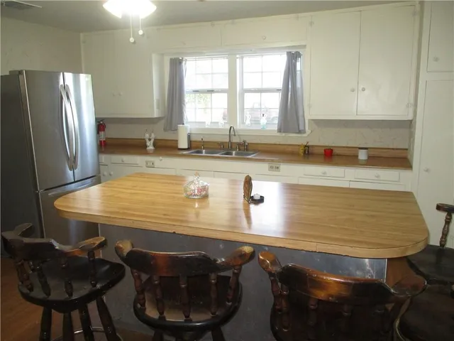 a room with dining table and chairs