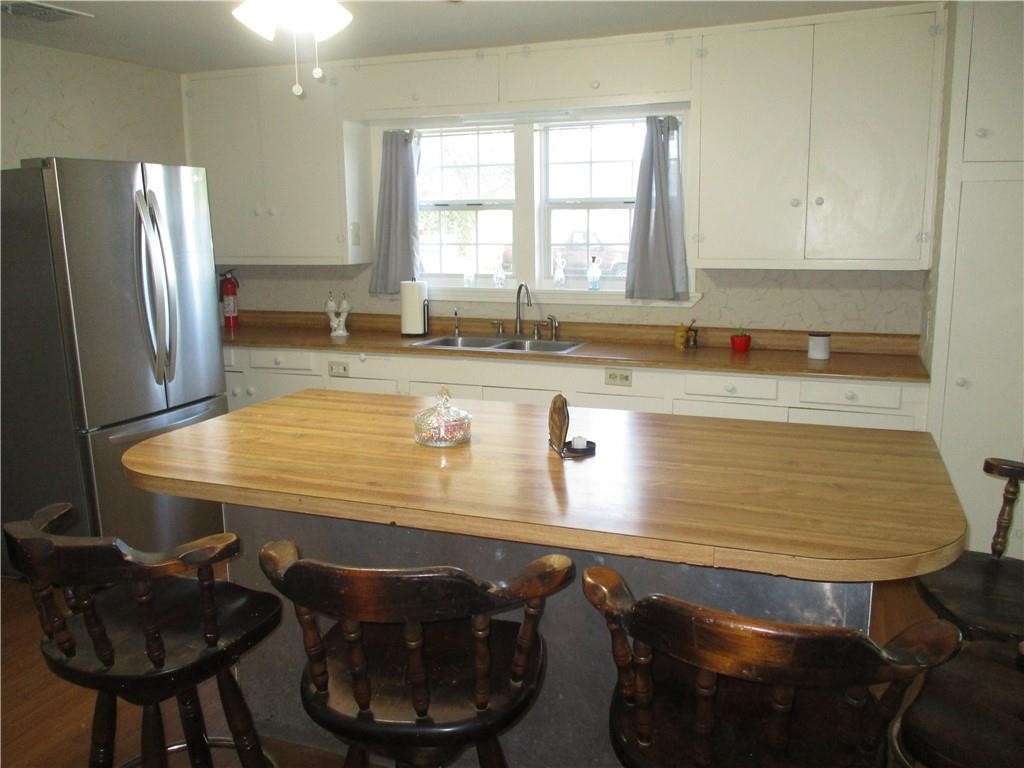 4110 Callicoatte Road Corpus Christi, TX 78410 - Photo 7 of 16 a room with dining table and chairs