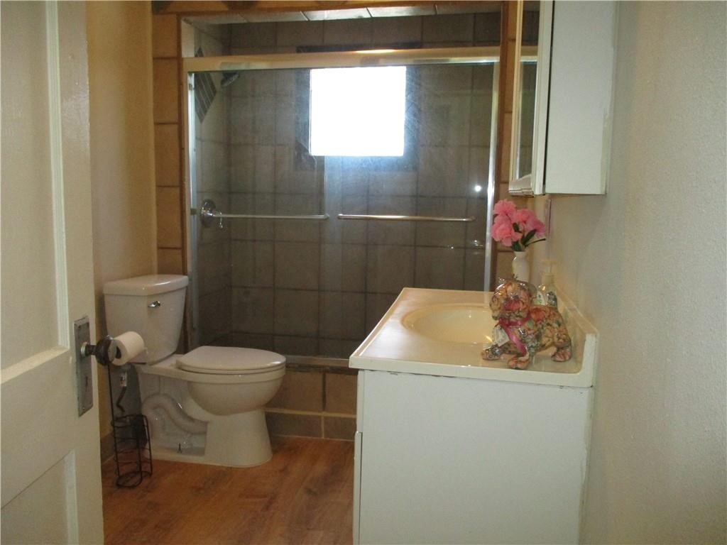 4110 Callicoatte Road Corpus Christi, TX 78410 - Photo 8 of 16 a bathroom with a sink and a toilet