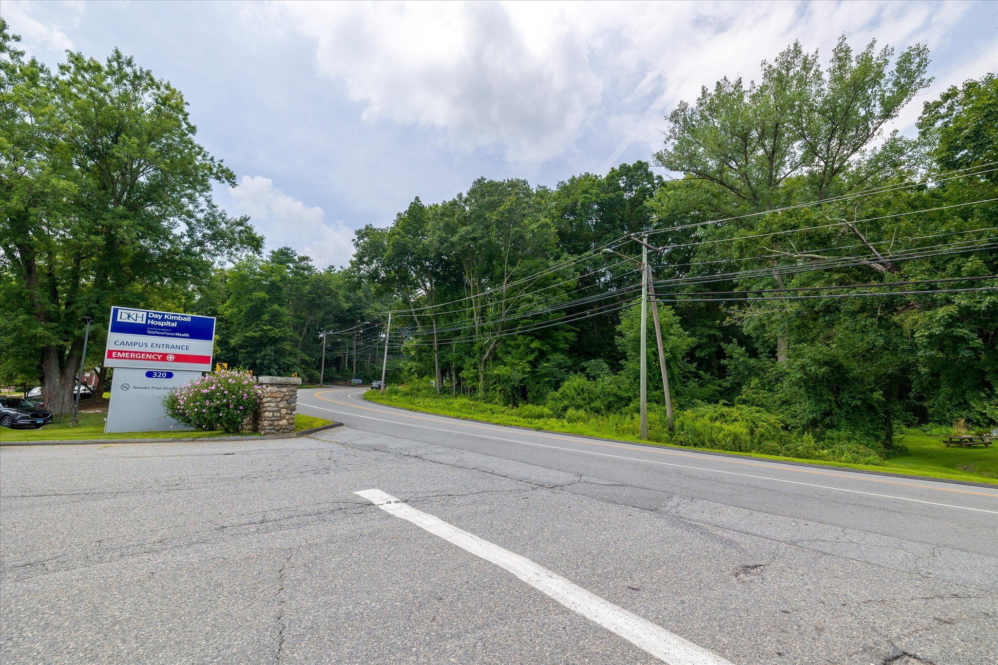 219 Pomfret Street Putnam, CT 06260 - Photo 16 of 16 a green field with some trees in the background