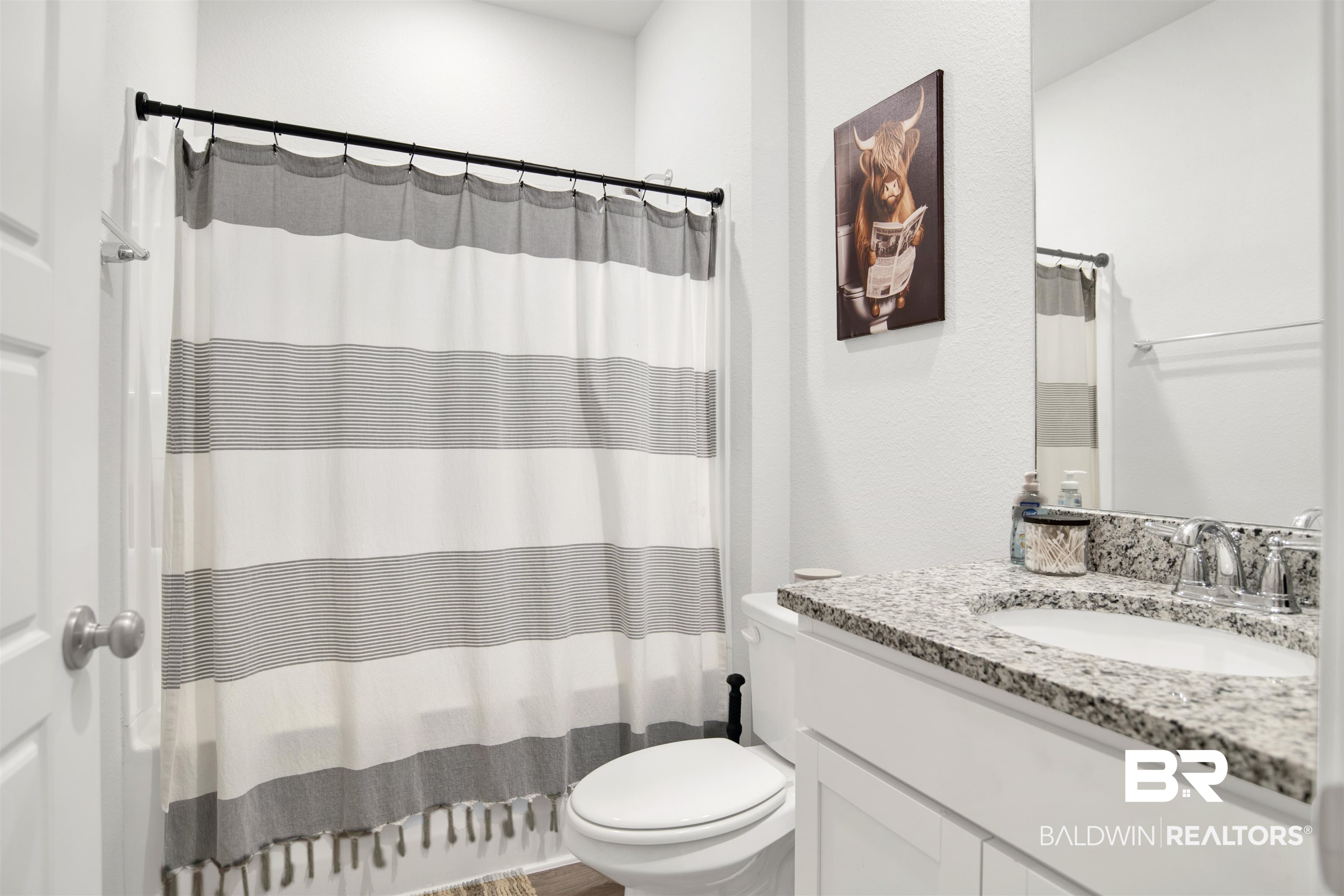 12813 Patriot Way Daphne, AL 36527 - Photo 14 of 23 Bathroom featuring a white vanity with a speckled countertop, undermount sink, and chrome fixtures