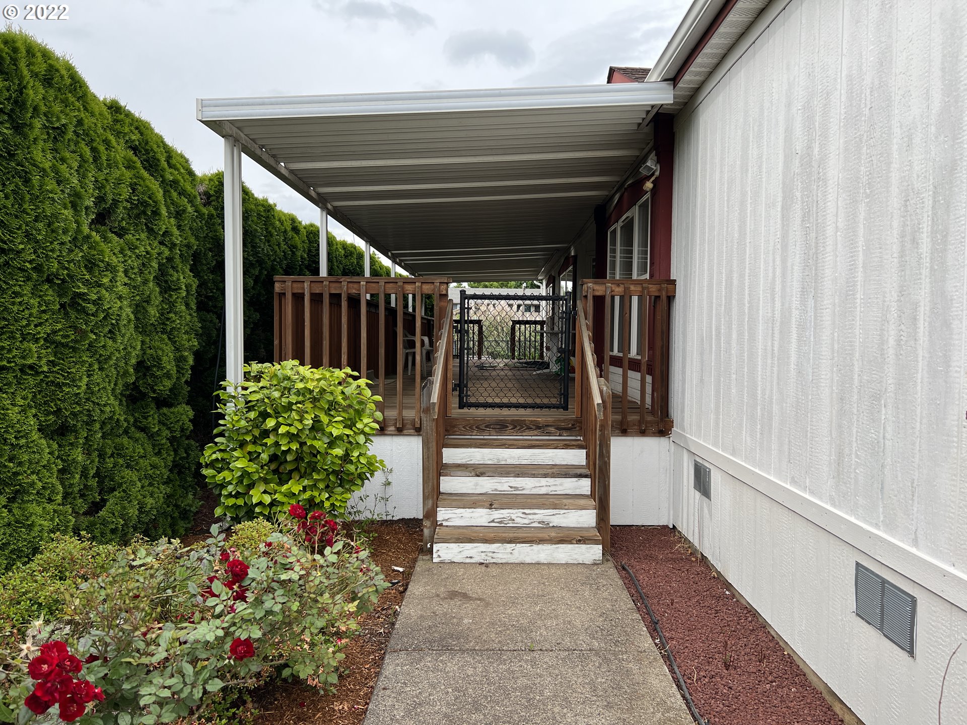 2150 Laura Street, Unit 211 Springfield, OR 97477 - Photo 3 of 14 a view of entryway with flower pots