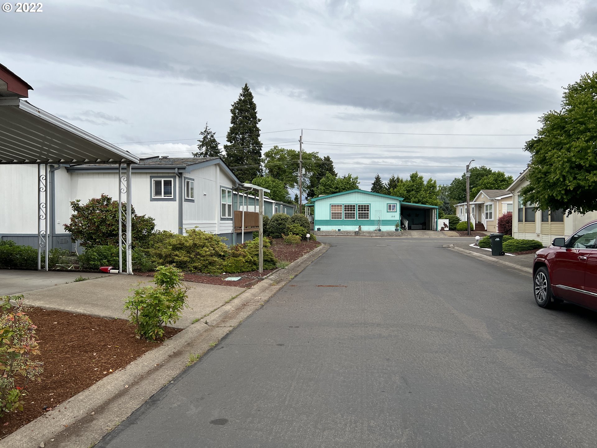 2150 Laura Street, Unit 211 Springfield, OR 97477 - Photo 8 of 14 a view of street with parked cars