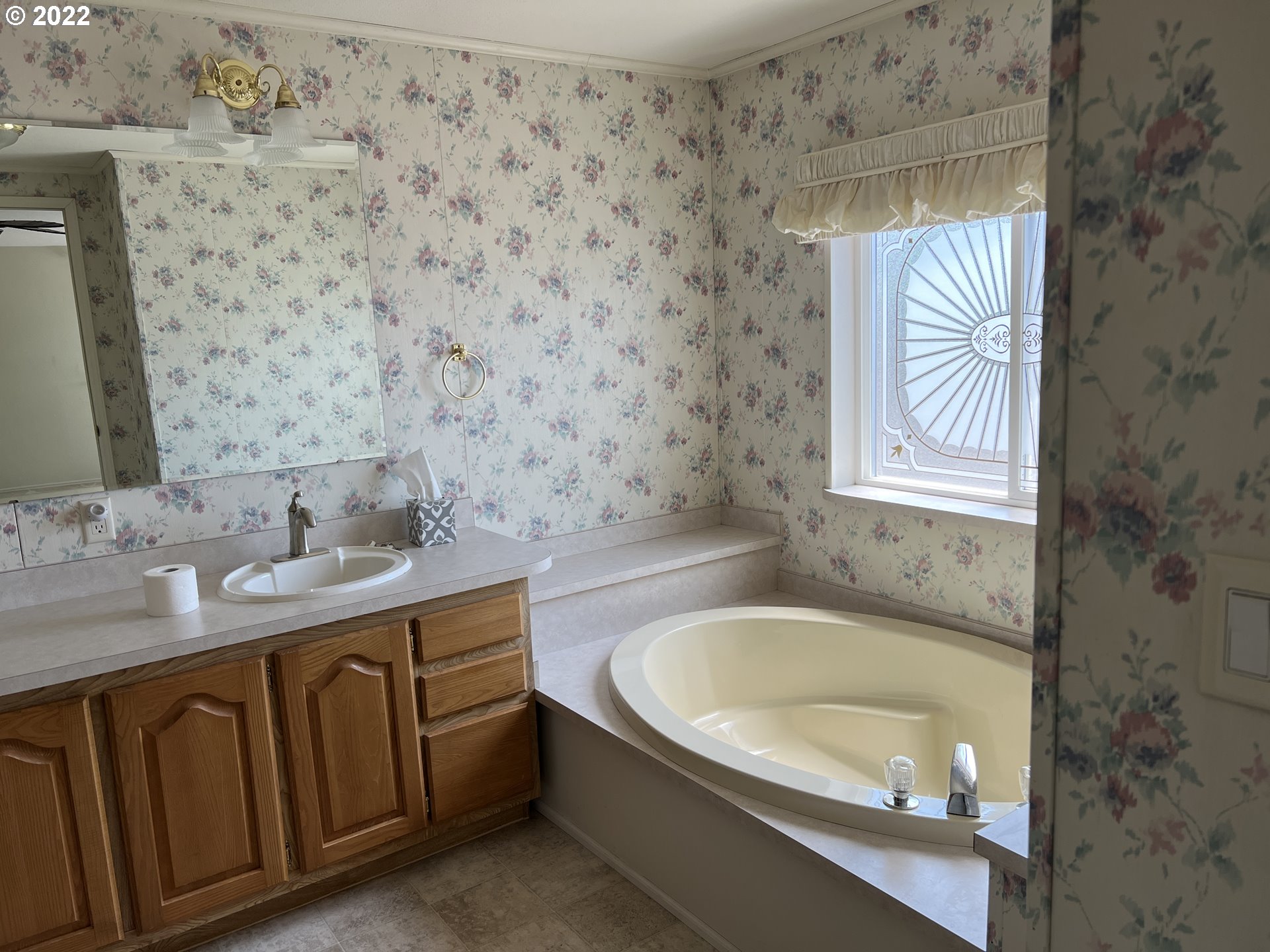 2150 Laura Street, Unit 211 Springfield, OR 97477 - Photo 9 of 14 a bathroom with a granite countertop sink a toilet and bathtub