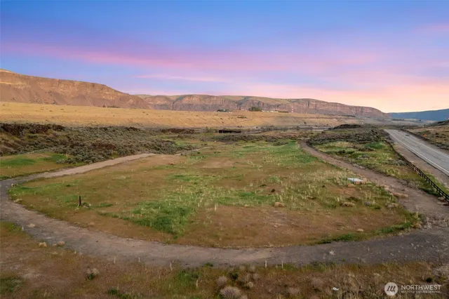 a view of an ocean beach and mountain