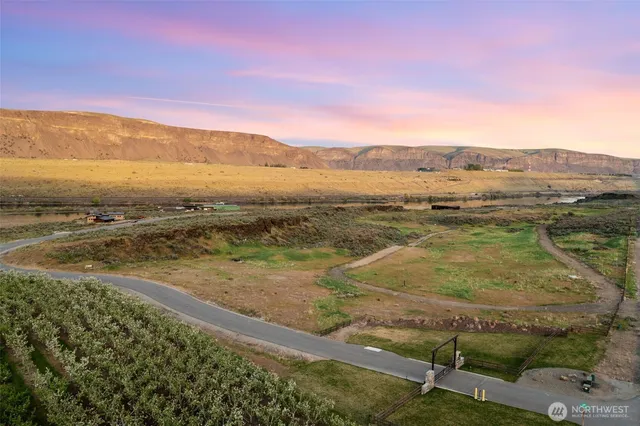 an aerial view of ocean and mountains