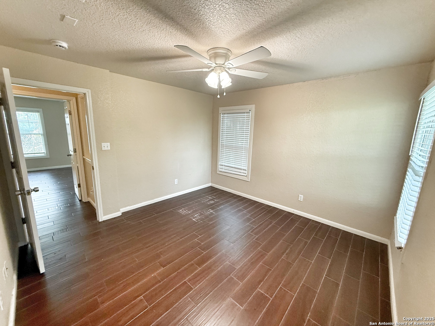 3339 Marion Road Marion, TX 78124 - Photo 12 of 19 wooden floor in an empty room with a window