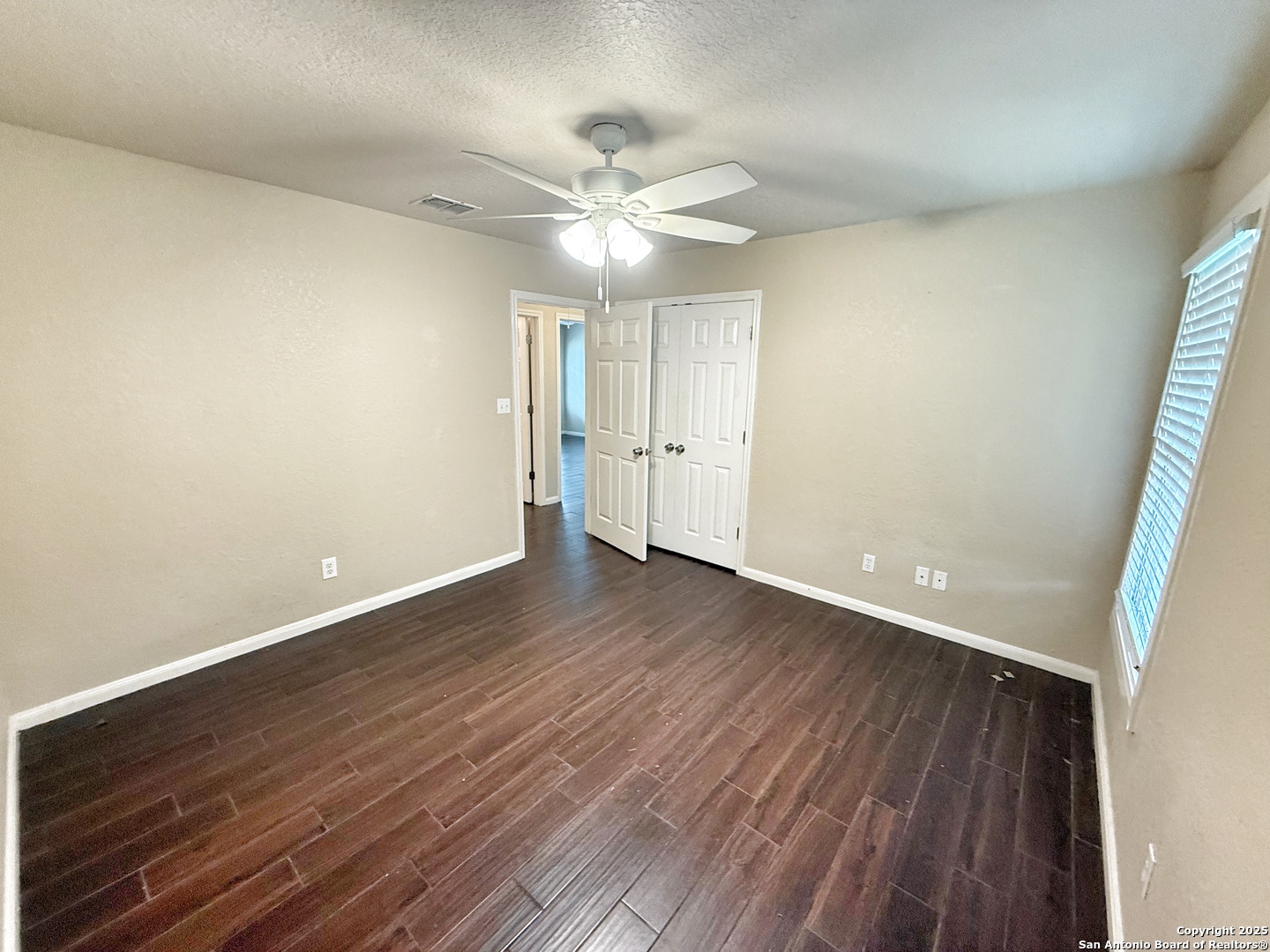 3339 Marion Road Marion, TX 78124 - Photo 16 of 19 wooden floor in an empty room with a window