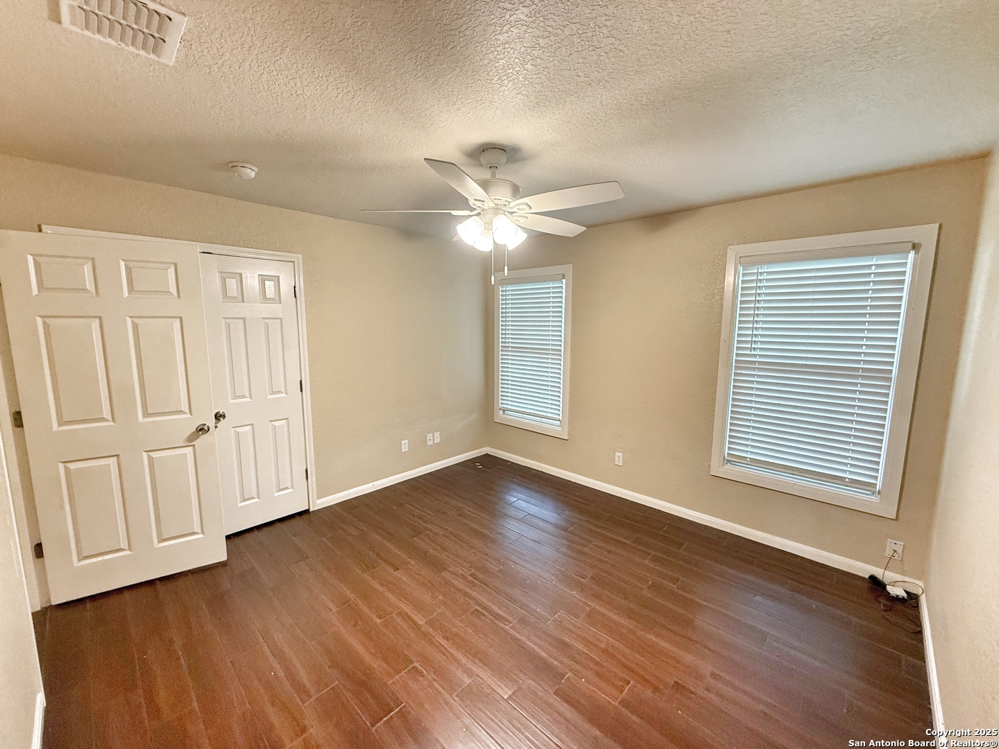 3339 Marion Road Marion, TX 78124 - Photo 17 of 19 a view of an empty room with wooden floor and a window