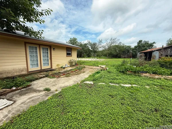 a backyard of a house with lots of green space