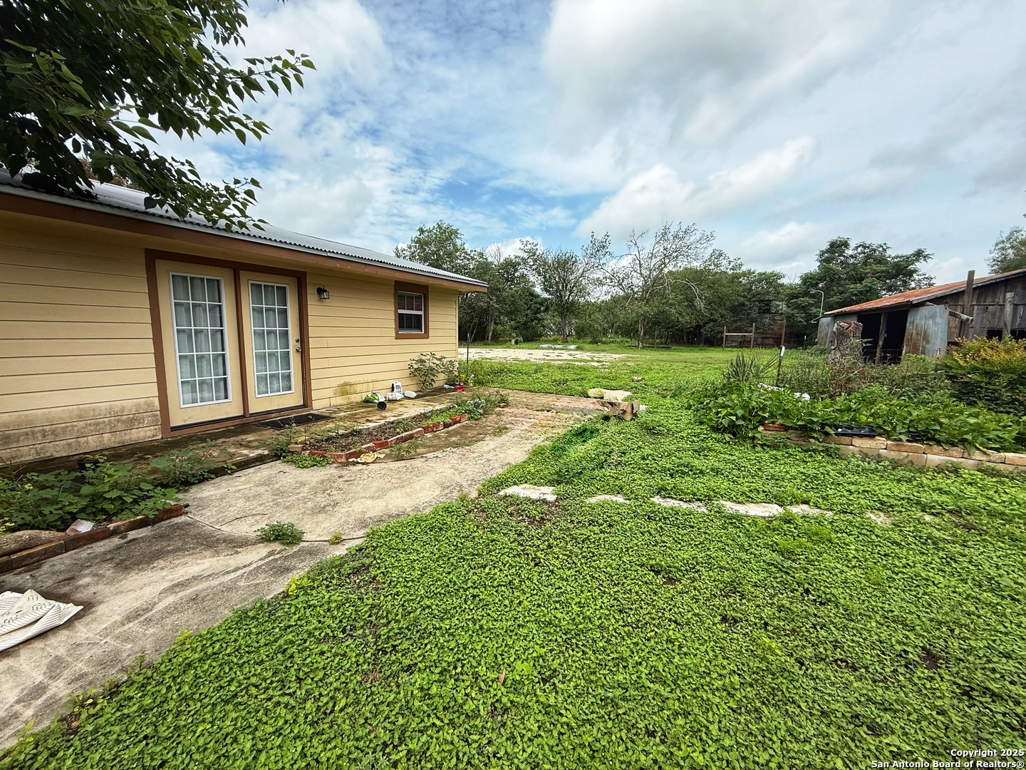 3339 Marion Road Marion, TX 78124 - Photo 19 of 19 a backyard of a house with lots of green space