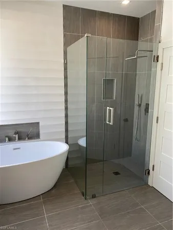 a bathroom with a bathtub and sink