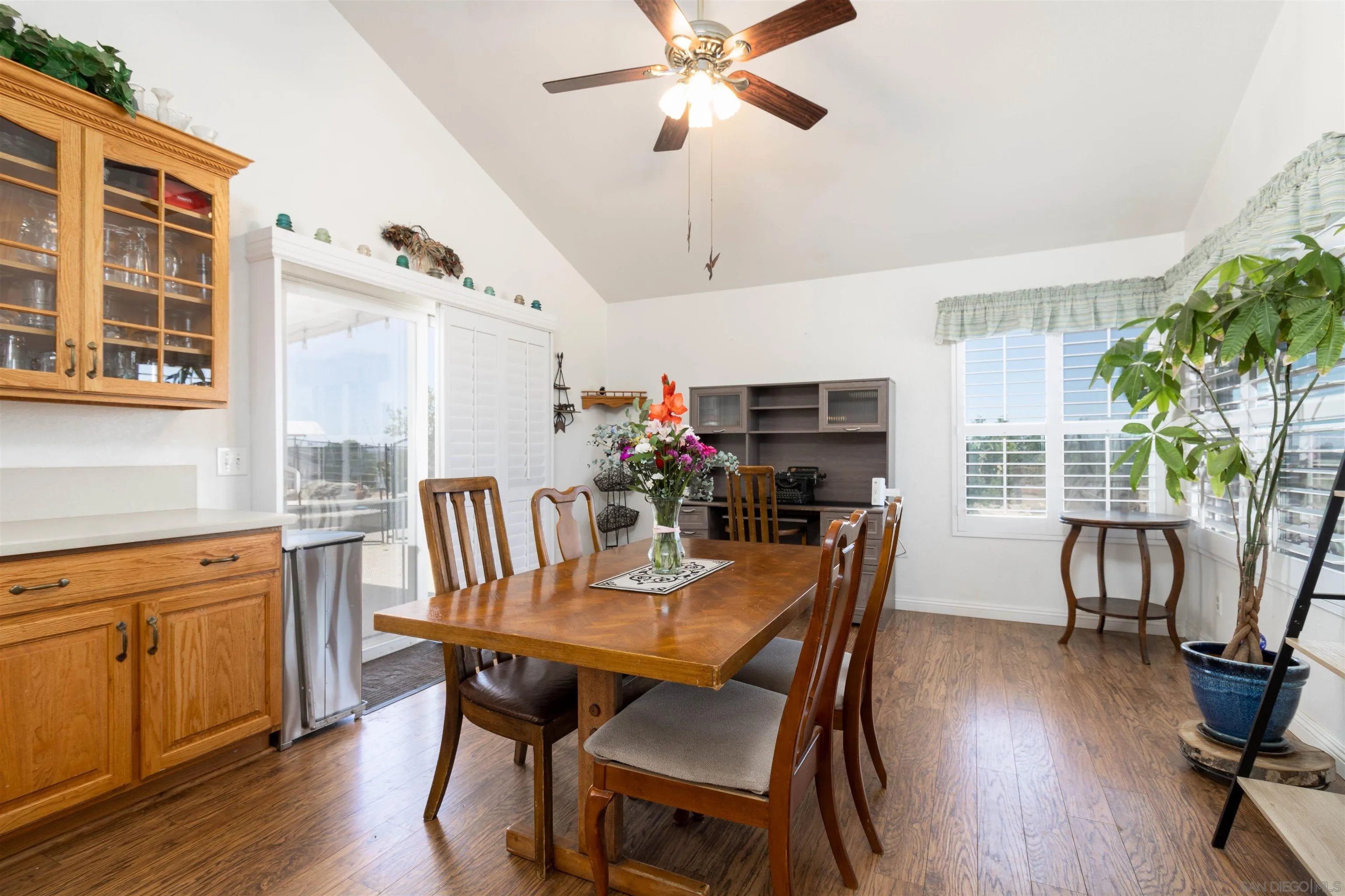 27373 Carlata Lane Valley Center, CA 92082 - Photo 11 of 22 a view of a dining room with furniture window and wooden floor
