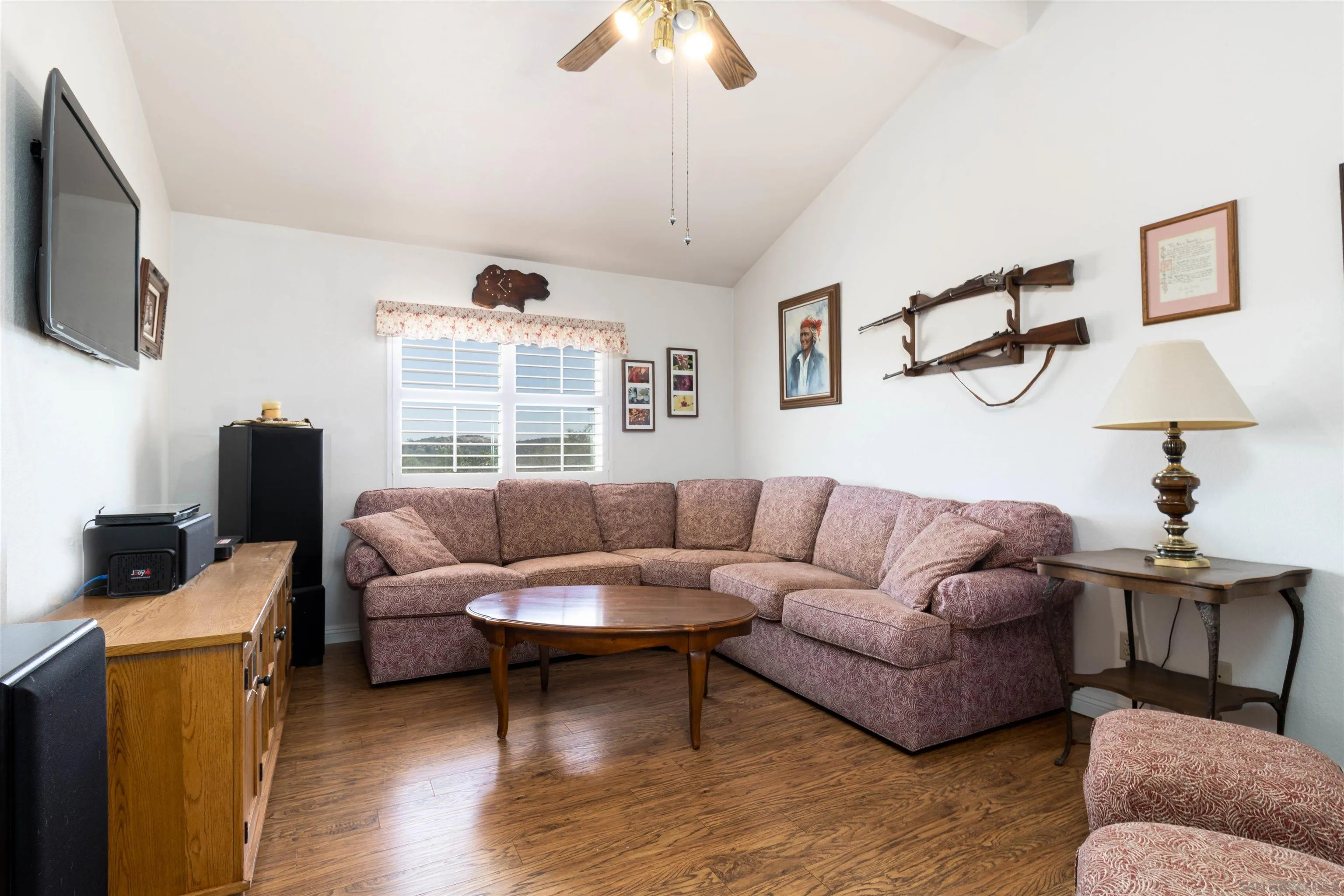 27373 Carlata Lane Valley Center, CA 92082 - Photo 16 of 22 a living room with furniture and a flat screen tv