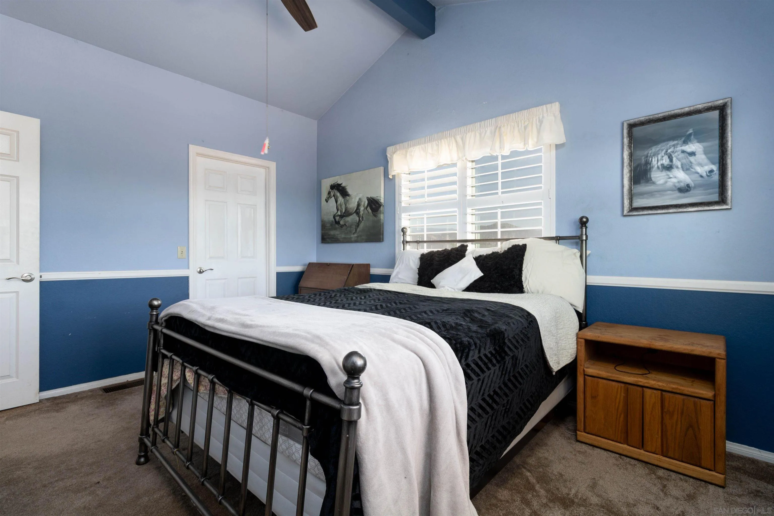 27373 Carlata Lane Valley Center, CA 92082 - Photo 17 of 22 a bedroom with a bed and a window