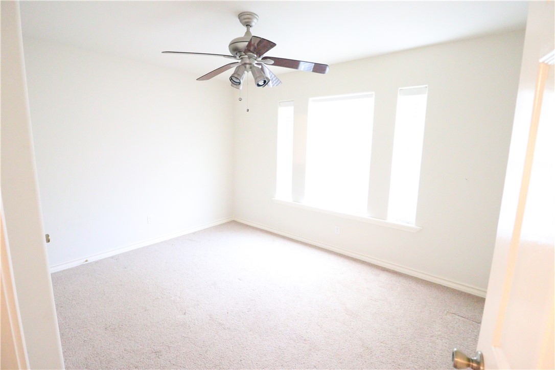 901 Strom Road Corpus Christi, TX 78418 - Photo 14 of 19 an empty room with a window
