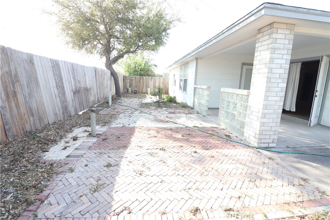 901 Strom Road Corpus Christi, TX 78418 - Photo 17 of 19 a view of a backyard with wooden fence