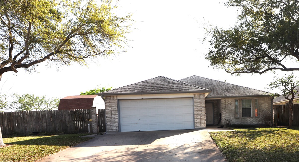 901 Strom Road Corpus Christi, TX 78418 - Photo 19 of 19 a front view of a house with a yard and garage