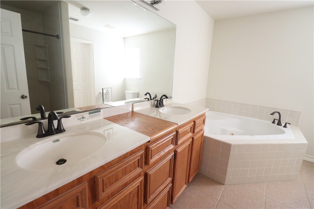 901 Strom Road Corpus Christi, TX 78418 - Photo 9 of 19 a bathroom with a sink and a mirror