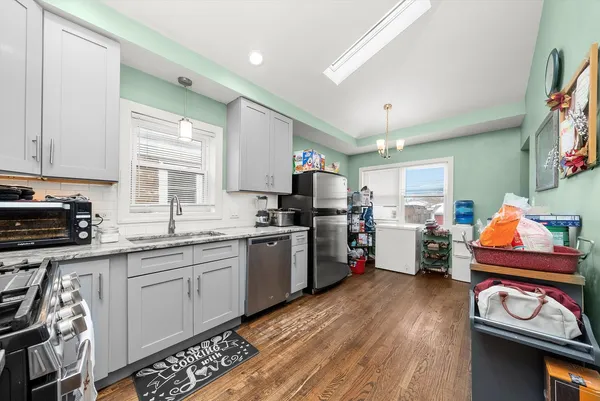 a kitchen with granite countertop lots of counter top space and dining table