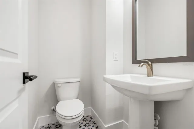 a bedroom with a large bed and a couch