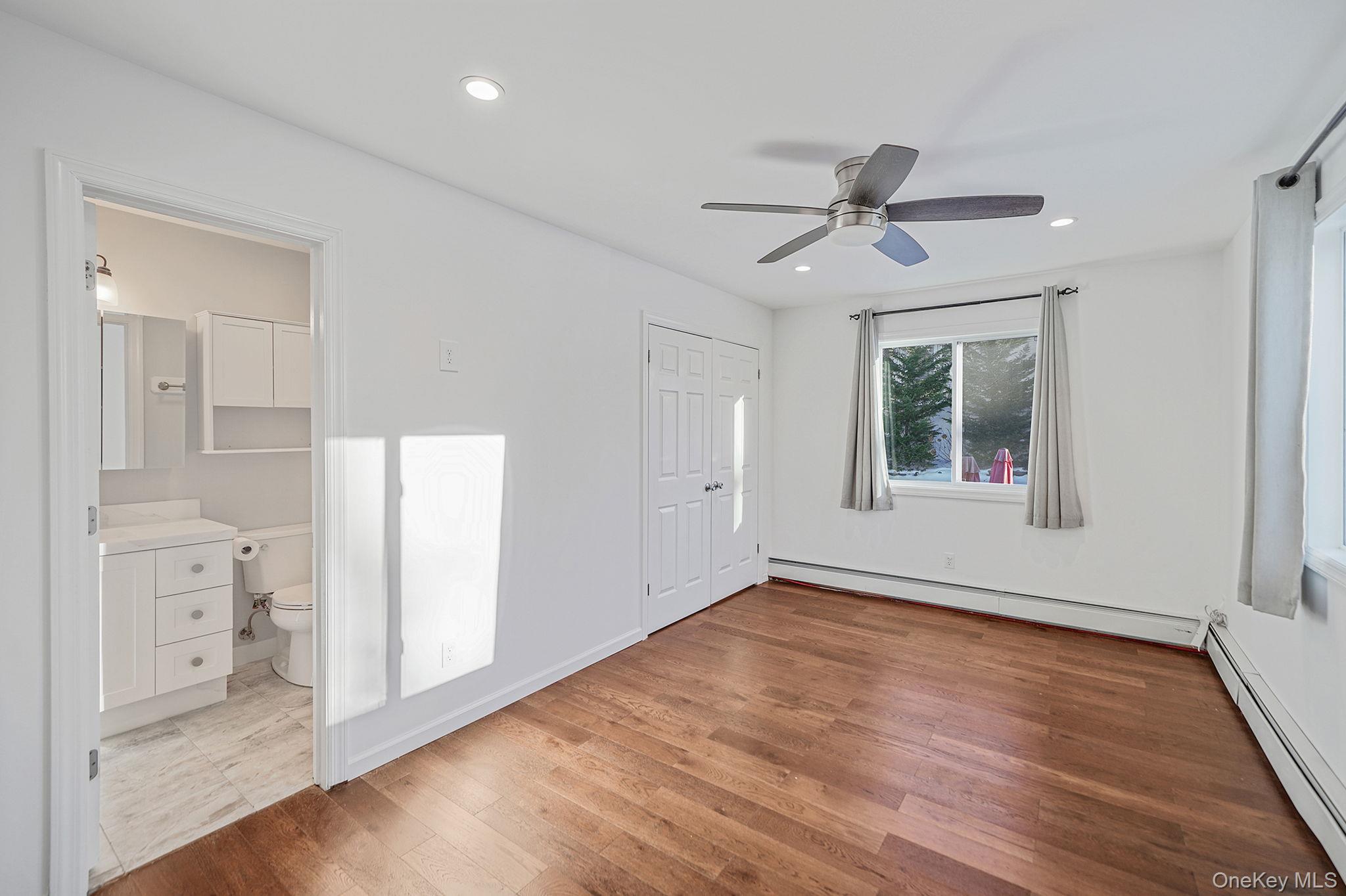38 Hawthorne Road Rocky Point, NY 11778 - Photo 17 of 27 wooden floor in an empty room with a window