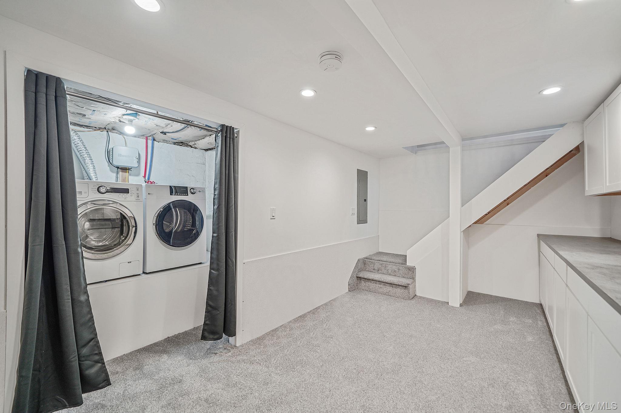 38 Hawthorne Road Rocky Point, NY 11778 - Photo 23 of 27 a view of a hallway with washer and dryer