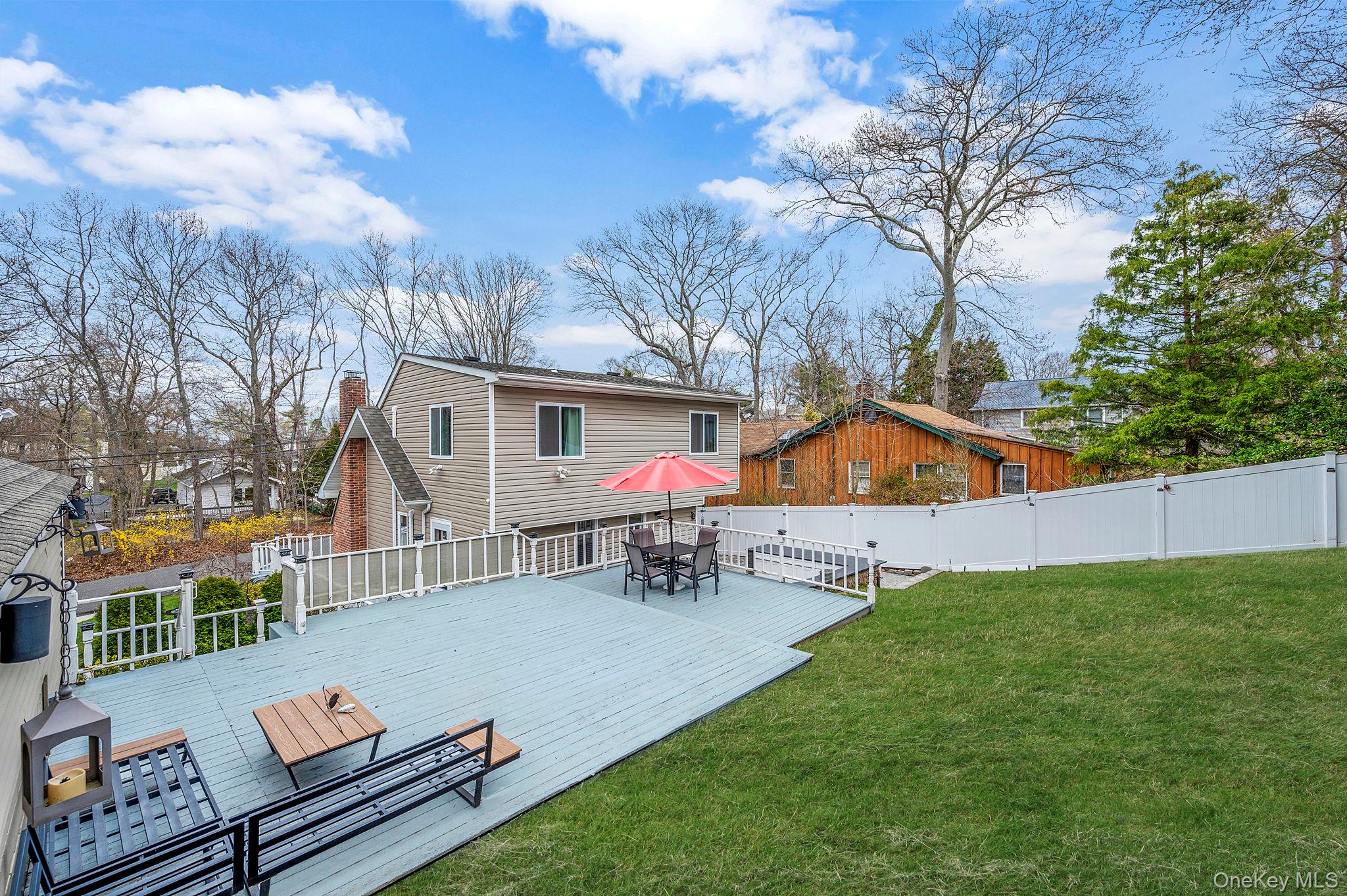 38 Hawthorne Road Rocky Point, NY 11778 - Photo 3 of 27 a view of a house with a chairs in a patio