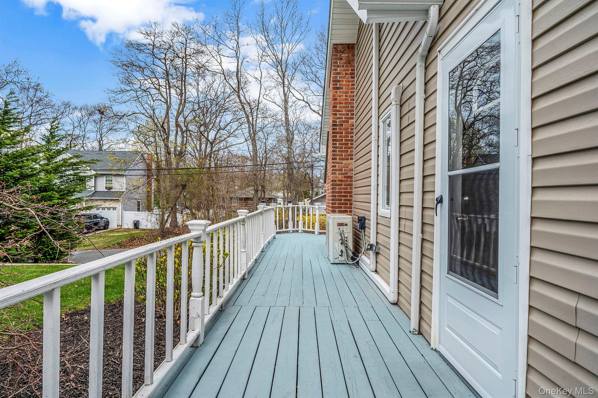 38 Hawthorne Road Rocky Point, NY 11778 - Photo 7 of 27 a view of a balcony with wooden floor