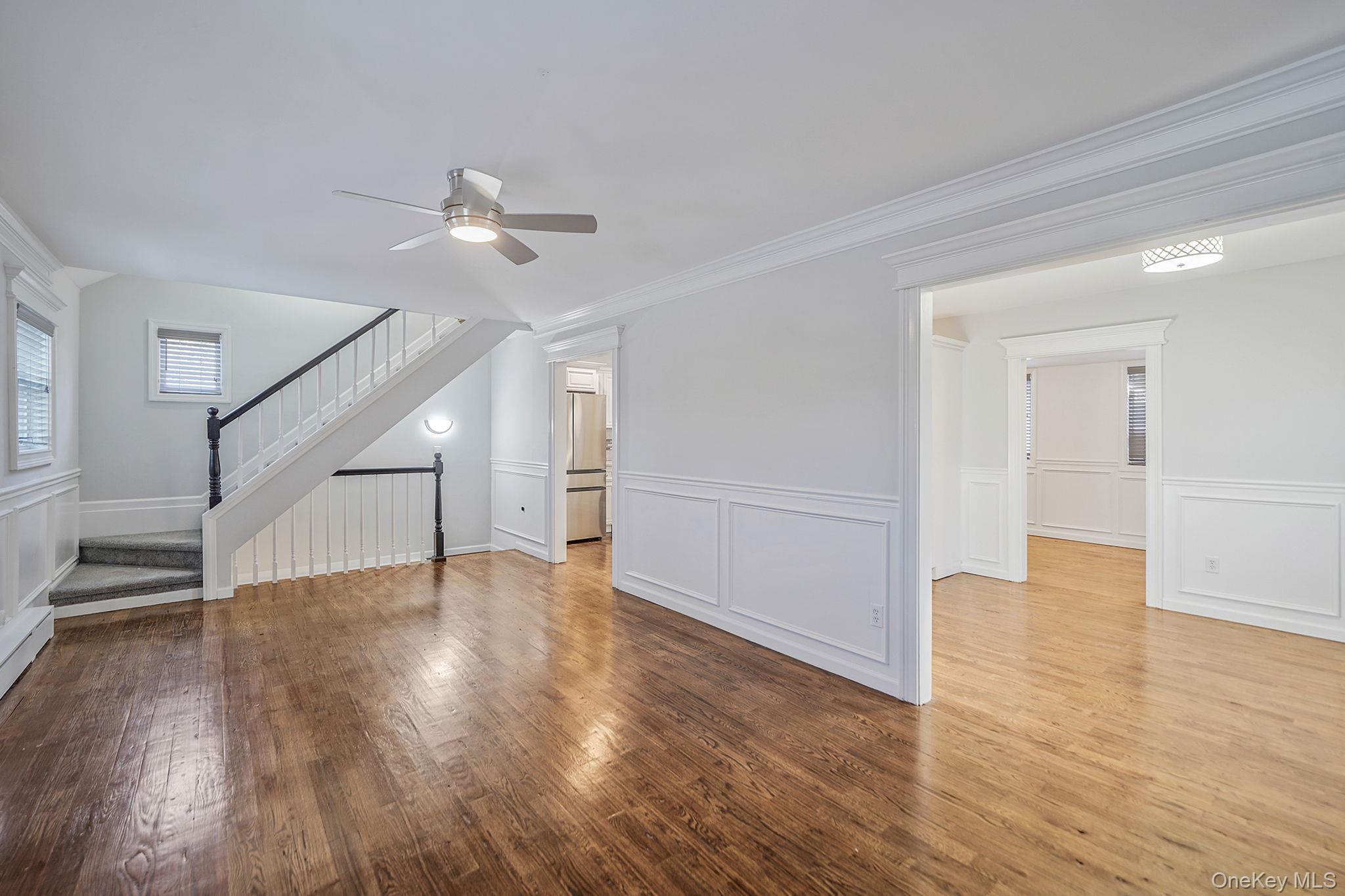 38 Hawthorne Road Rocky Point, NY 11778 - Photo 9 of 27 a view of an empty room with wooden floor ceiling fan
