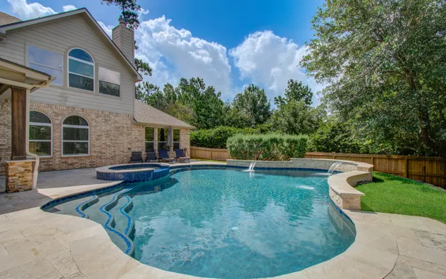 a view of a house with swimming pool