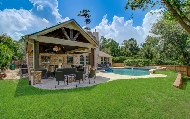 a view of a house with a yard porch and sitting area