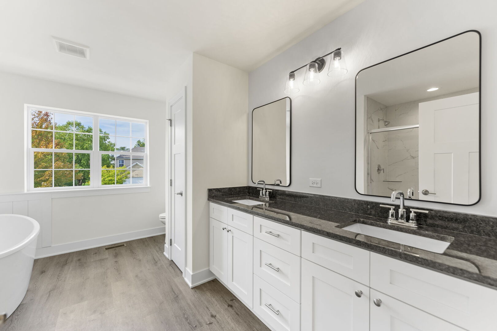 715 Fox Trail Terrace Cary, IL 60013 - Photo 11 of 22 a bathroom with a granite countertop sink and a mirror