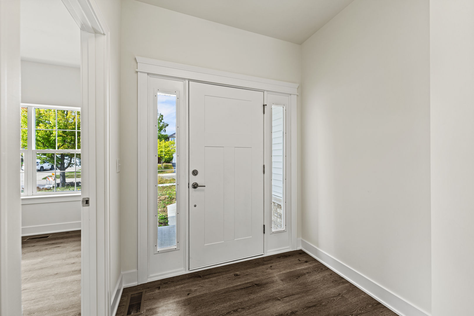715 Fox Trail Terrace Cary, IL 60013 - Photo 2 of 22 an empty room with wooden floor closet and windows