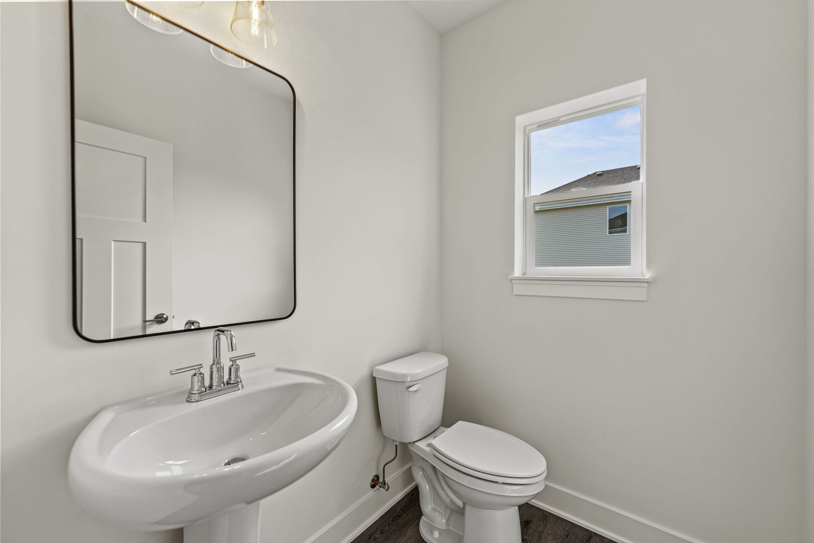 715 Fox Trail Terrace Cary, IL 60013 - Photo 8 of 22 a bathroom with a sink a toilet and mirror