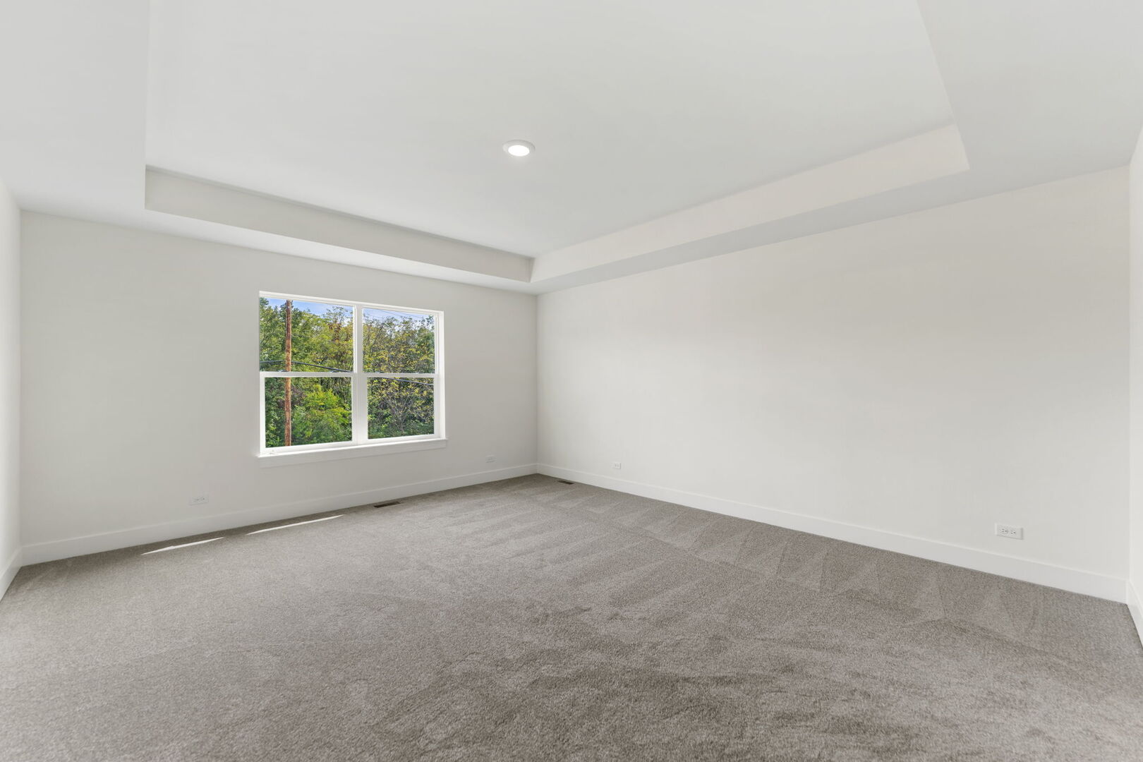 715 Fox Trail Terrace Cary, IL 60013 - Photo 9 of 22 an empty room with windows