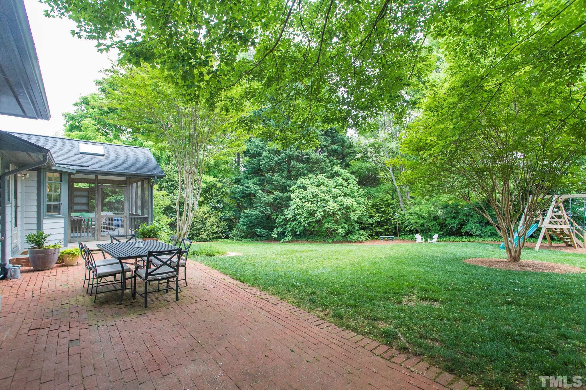 3431 Churchill Road Raleigh, NC 27607 - Photo 11 of 47 a view of a house with backyard sitting area and garden