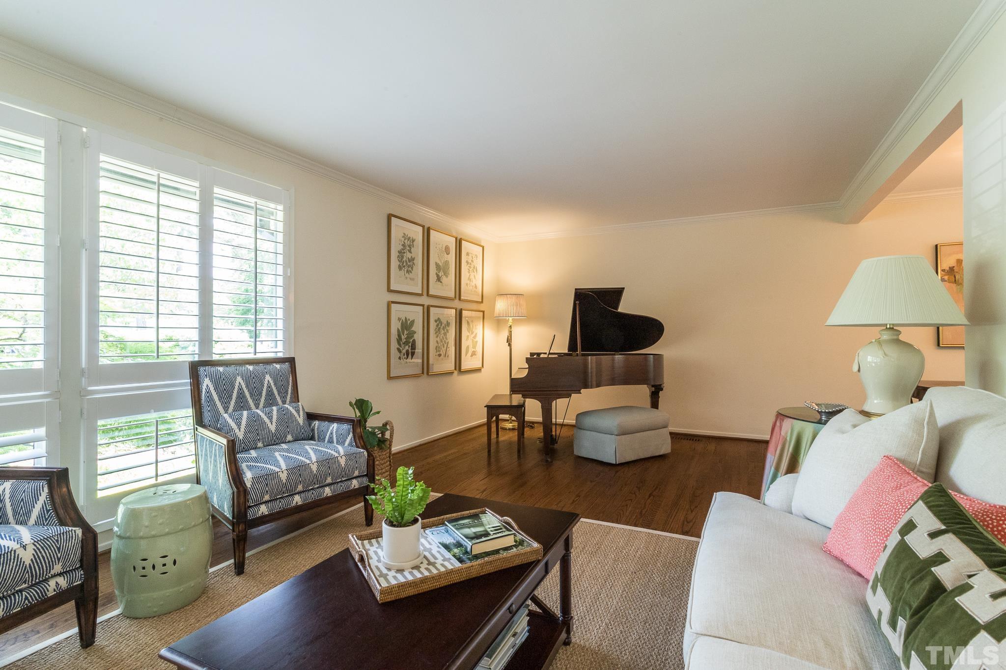 3431 Churchill Road Raleigh, NC 27607 - Photo 16 of 47 a living room with furniture and wooden floor