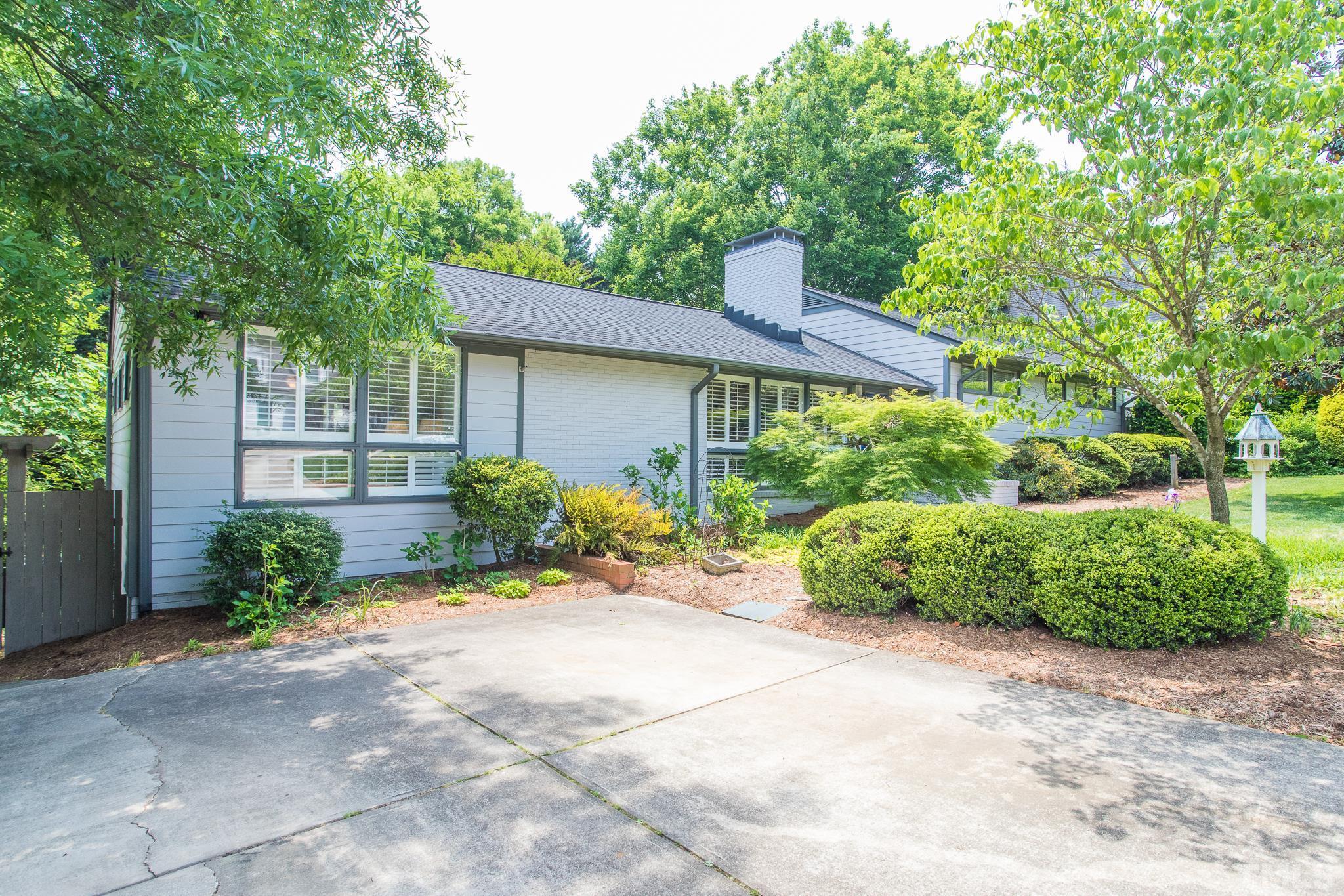 3431 Churchill Road Raleigh, NC 27607 - Photo 2 of 47 a front view of a house with garden