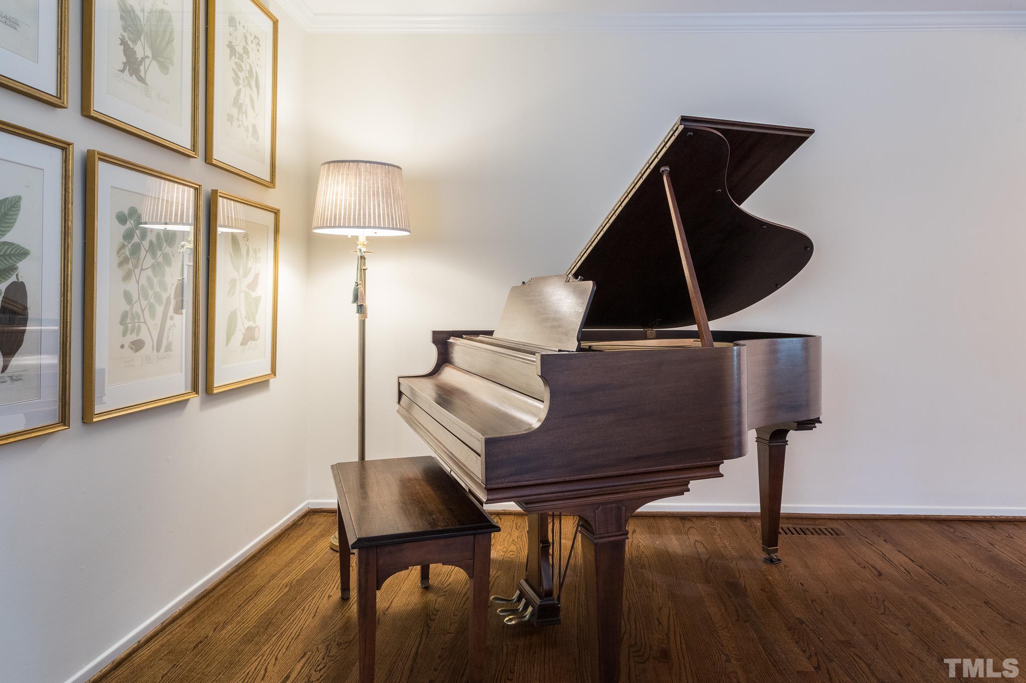 3431 Churchill Road Raleigh, NC 27607 - Photo 21 of 47 a living room with table chairs and wooden floor