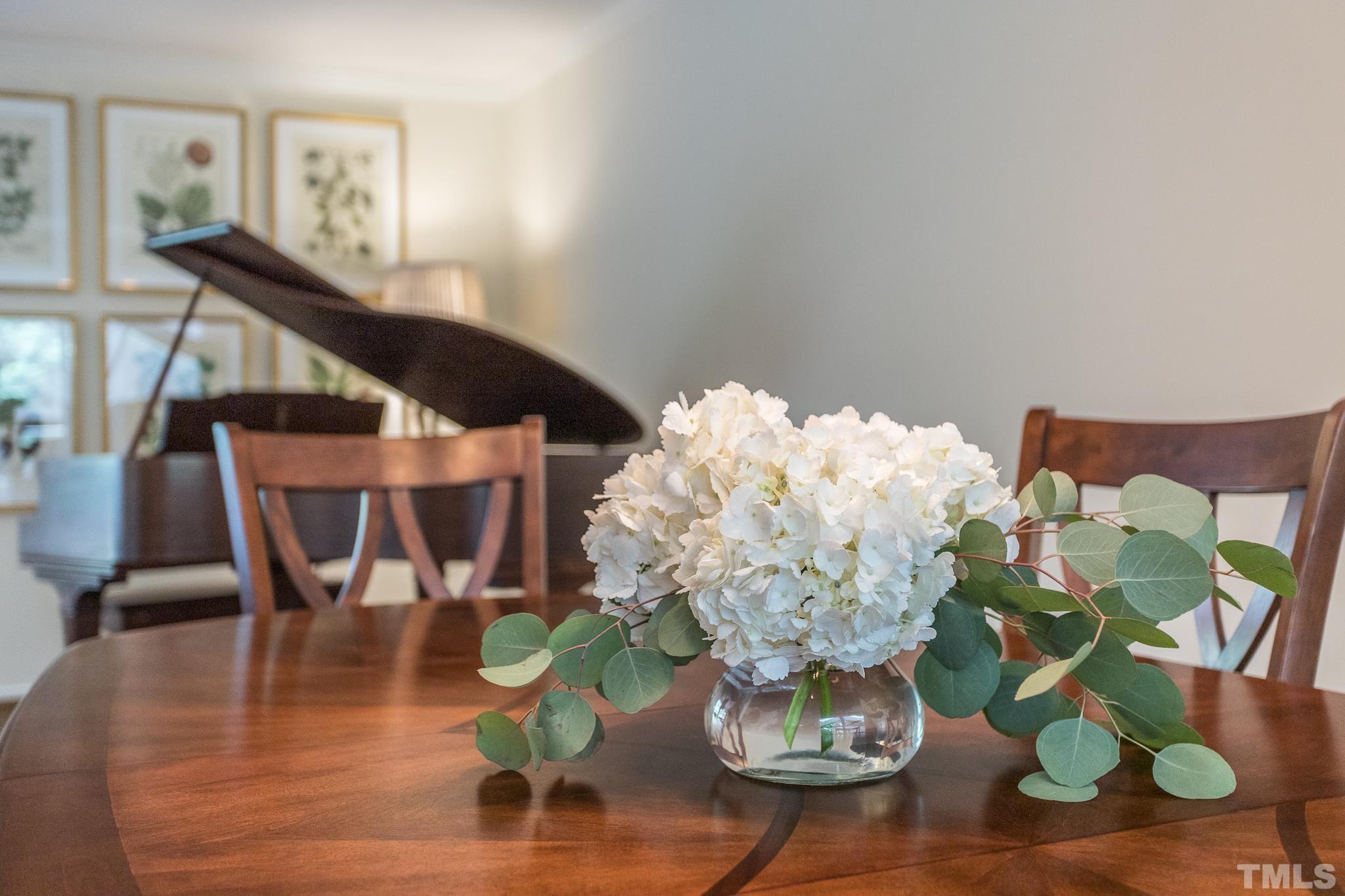 3431 Churchill Road Raleigh, NC 27607 - Photo 23 of 47 a vase of flowers sitting on a table
