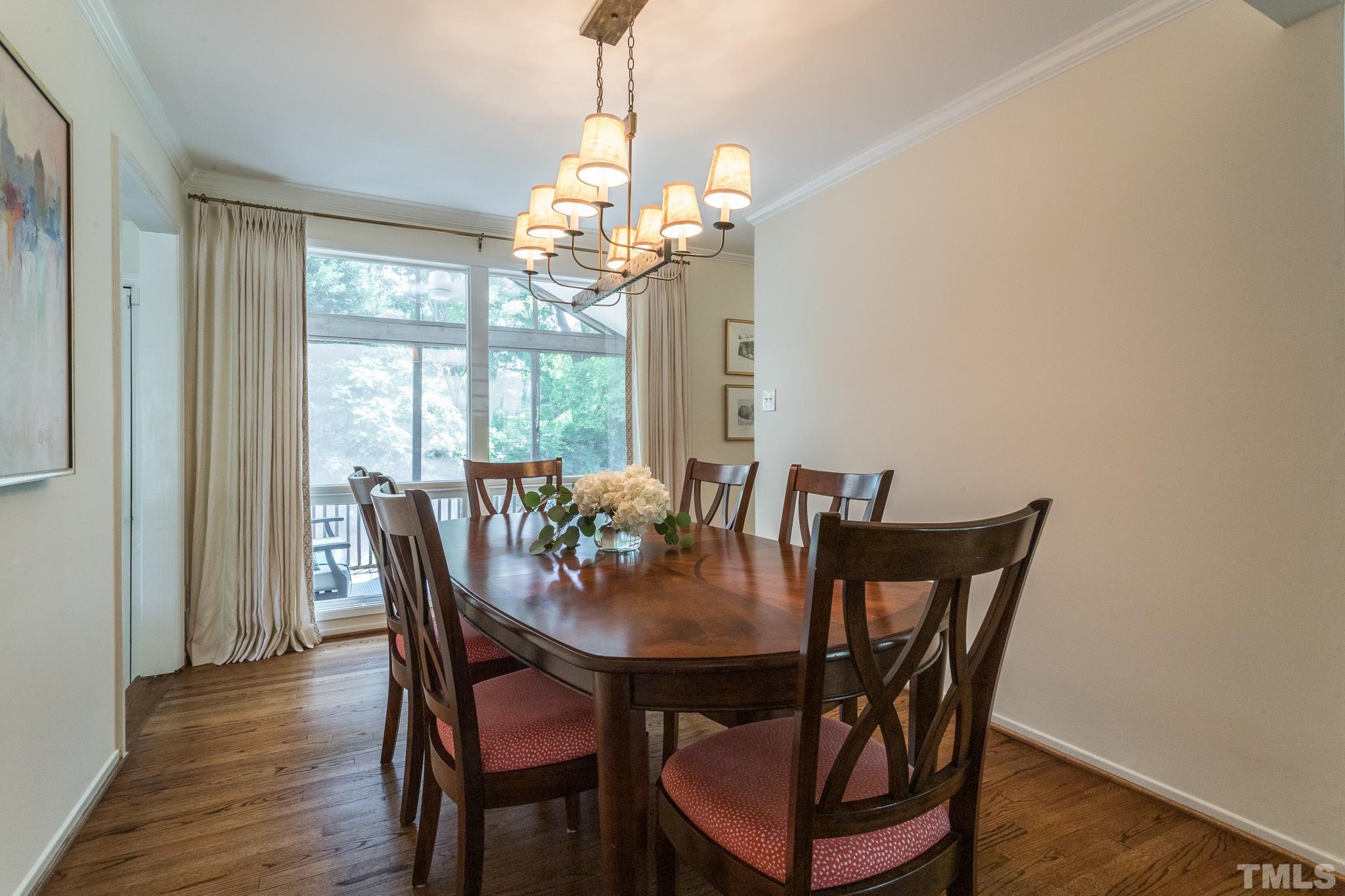 3431 Churchill Road Raleigh, NC 27607 - Photo 24 of 47 a view of a dining room with furniture window and wooden floor