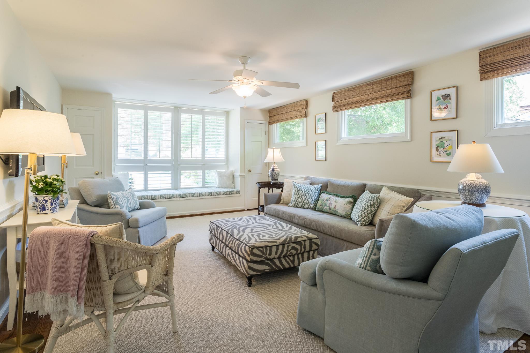 3431 Churchill Road Raleigh, NC 27607 - Photo 26 of 47 a living room with furniture a lamp and a window