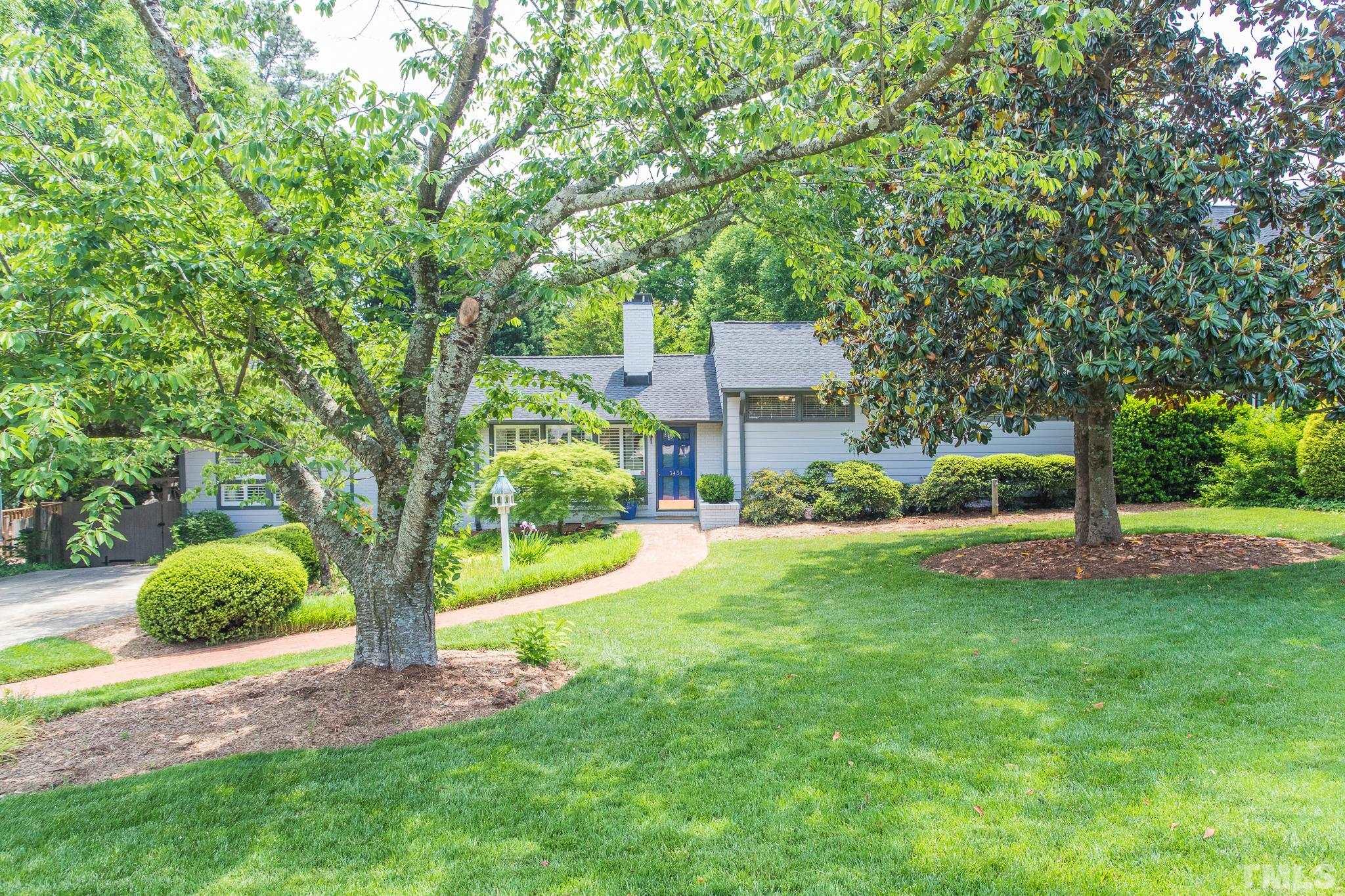 3431 Churchill Road Raleigh, NC 27607 - Photo 3 of 47 a view of a house with backyard and a tree
