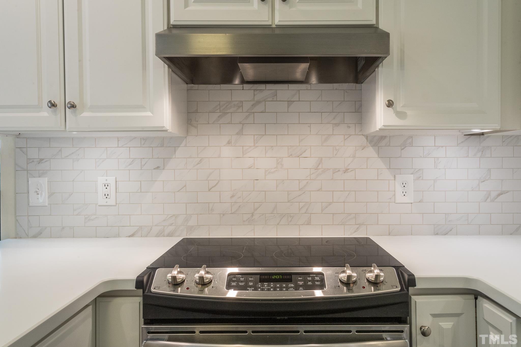3431 Churchill Road Raleigh, NC 27607 - Photo 33 of 47 a close view of a stove in the kitchen